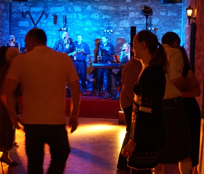 Pulse wedding band in Culcreuch Castle Fintry near Glasgow people dancing on busy dance floor with band in background