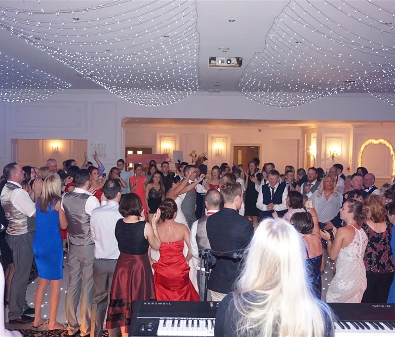 Pulse wedding band Glasgow & Ayrshire in Bothwell Bridge Hotel Motherwell people dancing on busy dance floor with band in background