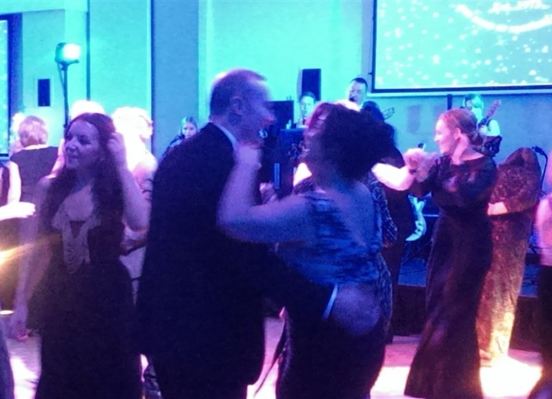 Pulse function band Glasgow & Ayrshire at St Andrew’s Sporting Club Winter Ball in the Radisson Blu Hotel in Glasgow people dancing on busy dance floor with band in background