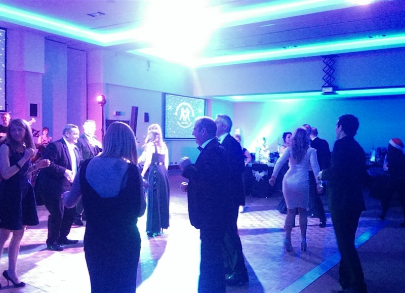 Pulse function band Glasgow & Ayrshire at St Andrew’s Sporting Club Winter Ball in the Radisson Blu Hotel in Glasgow people dancing on busy dance floor with band in background
