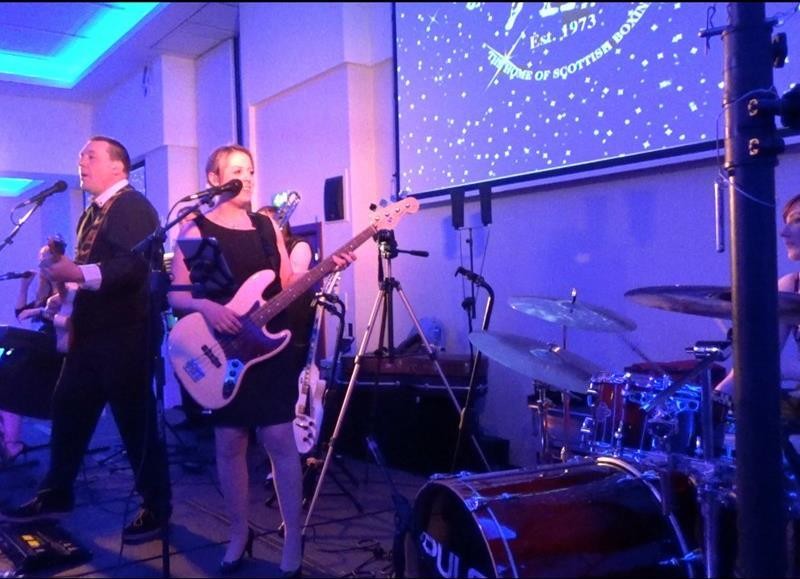 Pulse function band Glasgow & Ayrshire on stage at St Andrew's Sporting Club Winter Ball in the Radisson Blu Hotel in Glasgow